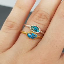 Load image into Gallery viewer, marquise Mohave turquoise raw gold and silver ring modelled on hand
