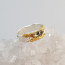 Load image into Gallery viewer, chunky sterling silver ring with raw herkimer diamond displayed on a crystal
