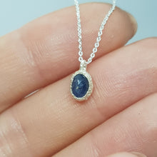 Load image into Gallery viewer, rose cut blue sapphire raw silver necklace displayed on hand
