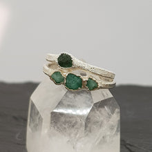 Load image into Gallery viewer, single and triple raw emerald silver ring displayed on a crystal
