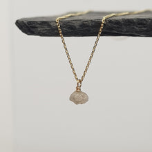 Load image into Gallery viewer, raw white diamond necklace on 9ct yellow gold chain, displayed hanging from a black slate
